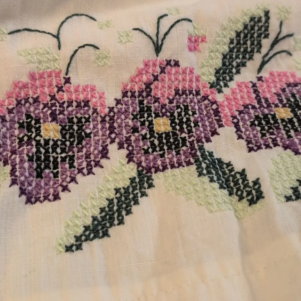 Vintage white pillowcase with embroidered purple‎ flowers